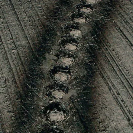 Microscopic image of a can coded with laser